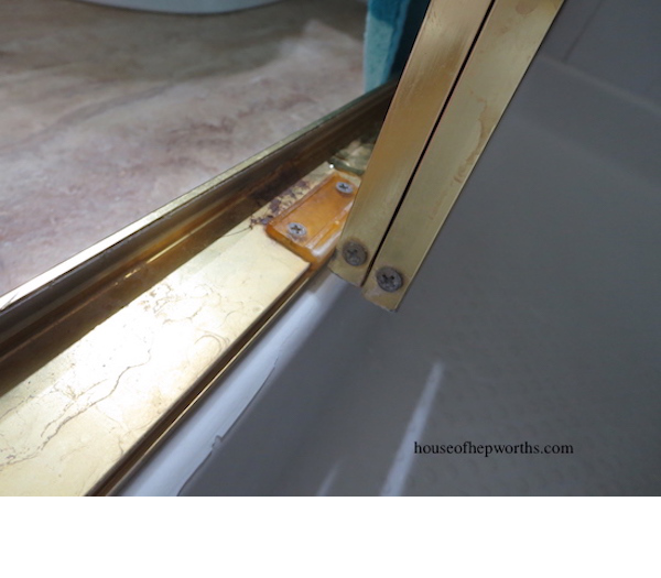 How to fix a sliding shower door guide